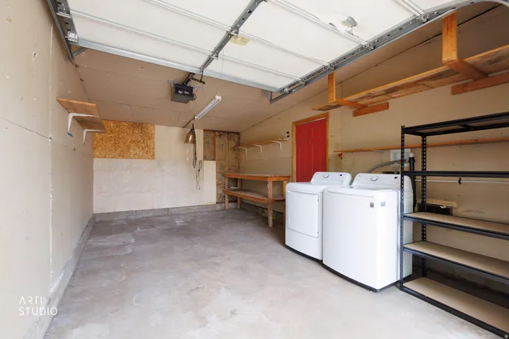 Concrete flooring with overhead garage door