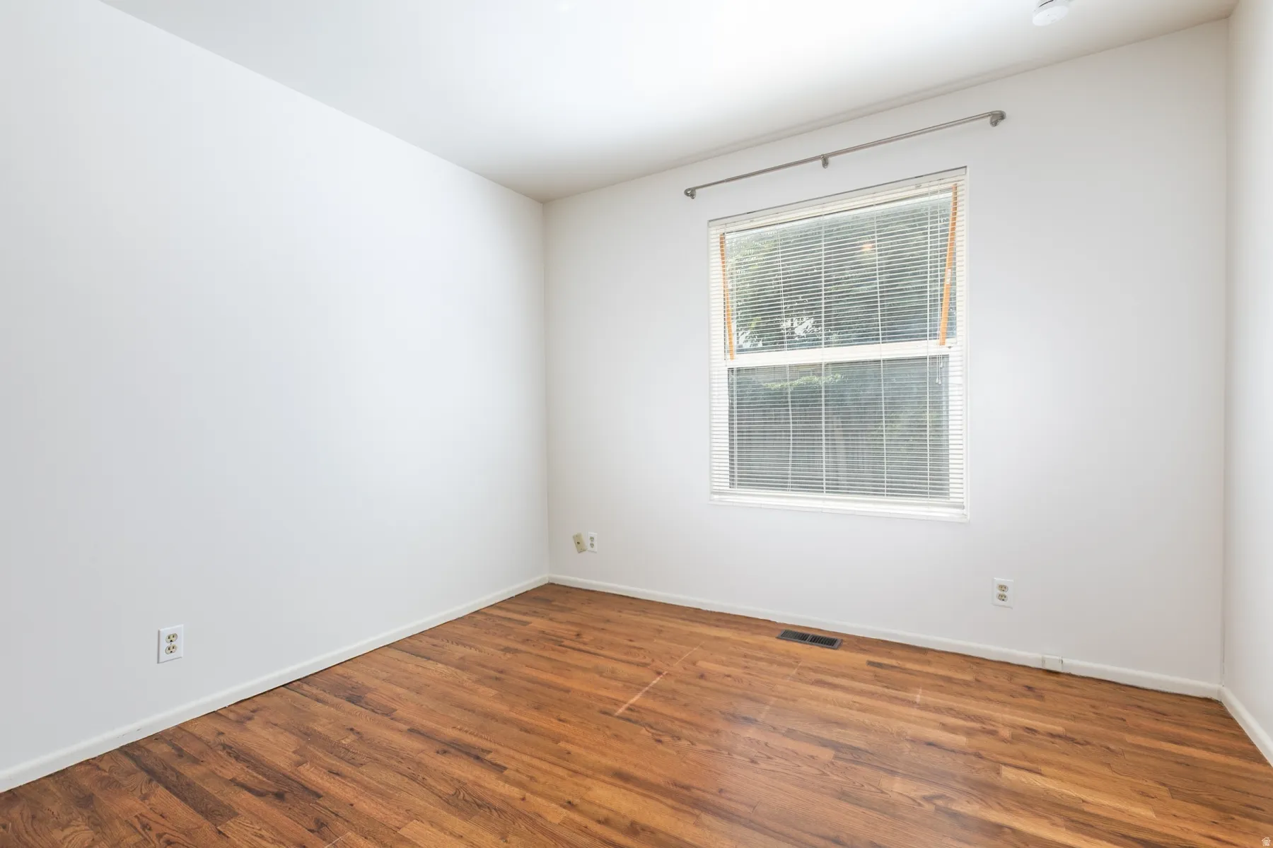Hardwood-style flooring throughout