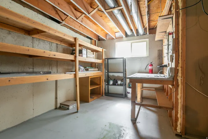 Exposed ceiling joists with visible ductwork