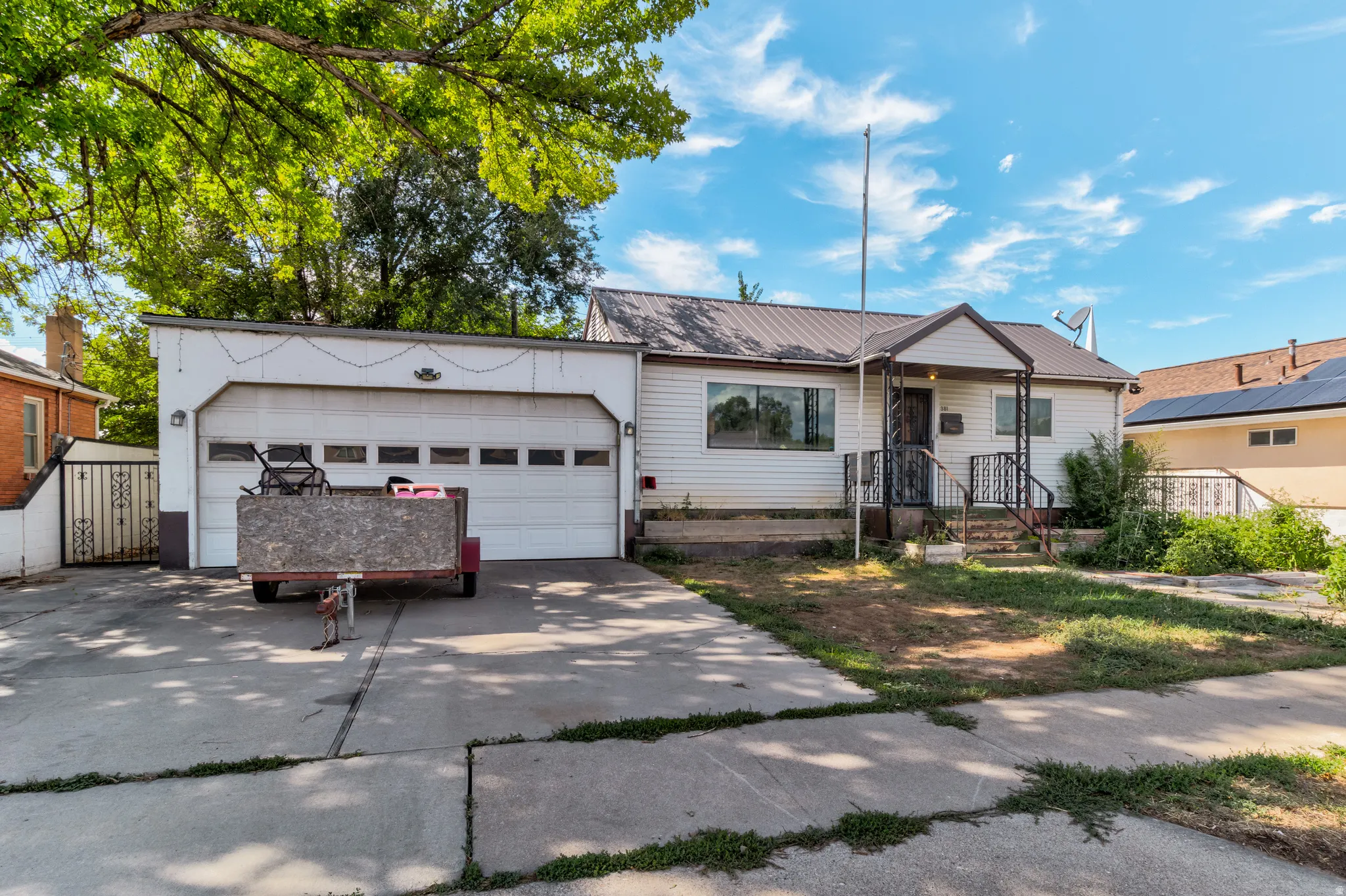 Attached garage with a wide driveway