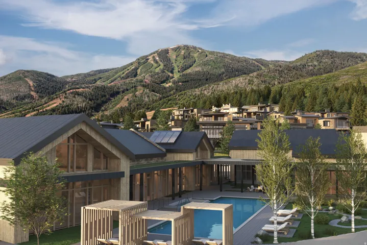 Contemporary residential architecture with prominent gables and a large outdoor swimming pool