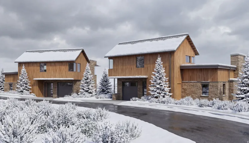 Wood-sided exterior with stone accents, gable roof, and integrated garage
