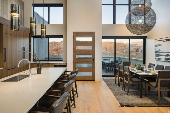 Spacious open-concept interior featuring high ceilings and light wood-finish flooring