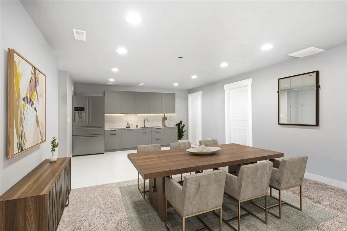 Recessed ceiling lighting, stainless steel appliances, gray cabinetry, tile backsplash, and white wood-finish flooring