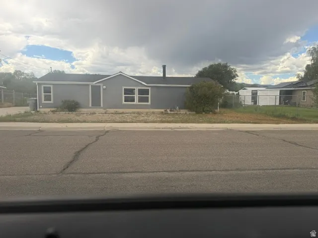 Gray exterior siding with white trim