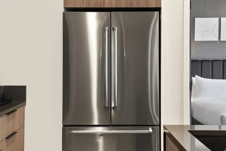 Full-size stainless refrigerator and kitchen storage, built for a full season in Park City.
