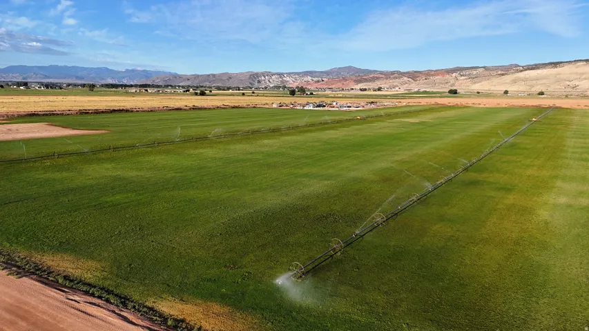 Expansive green fields with irrigation systems