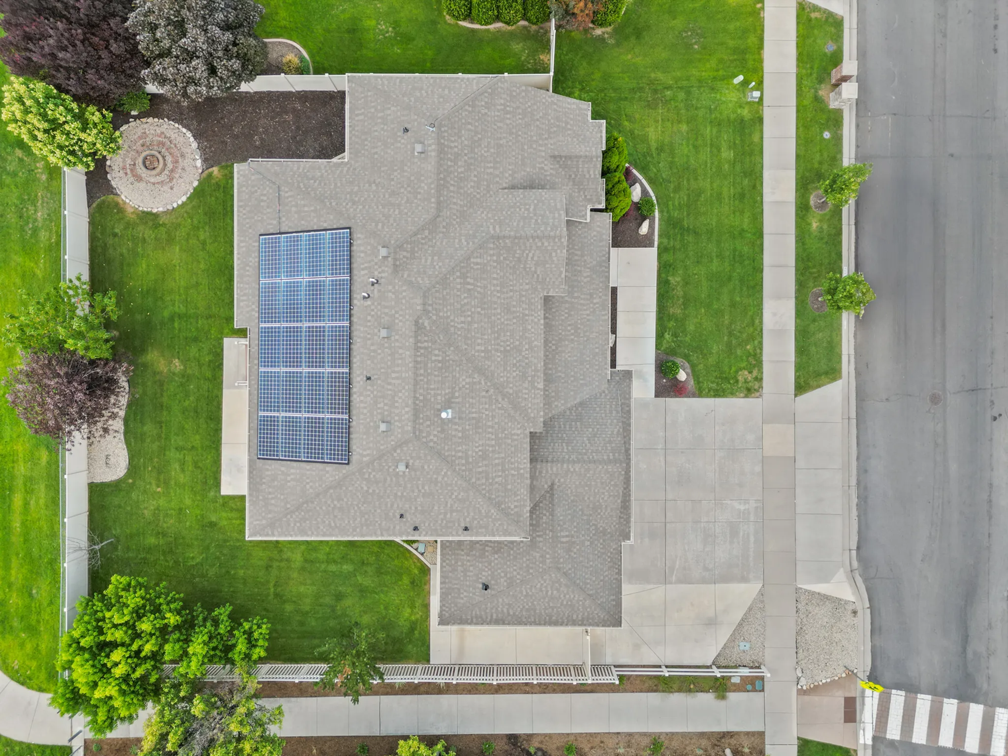 Solar panel array on a pitched roof with asphalt shingles