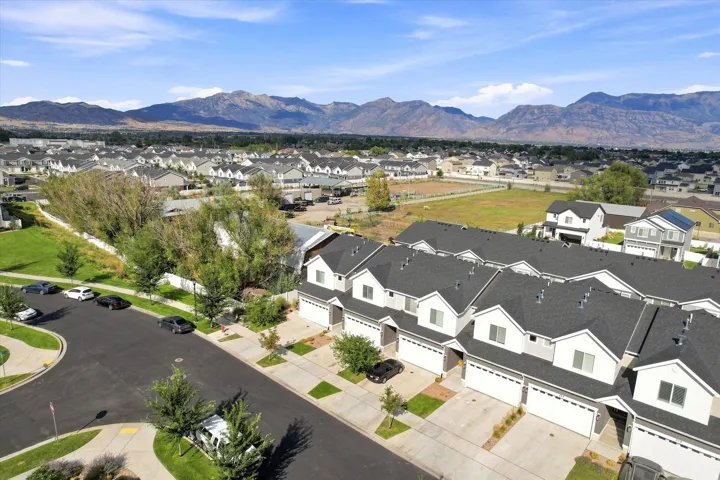 Townhome community with asphalt shingle roofs and integrated garages