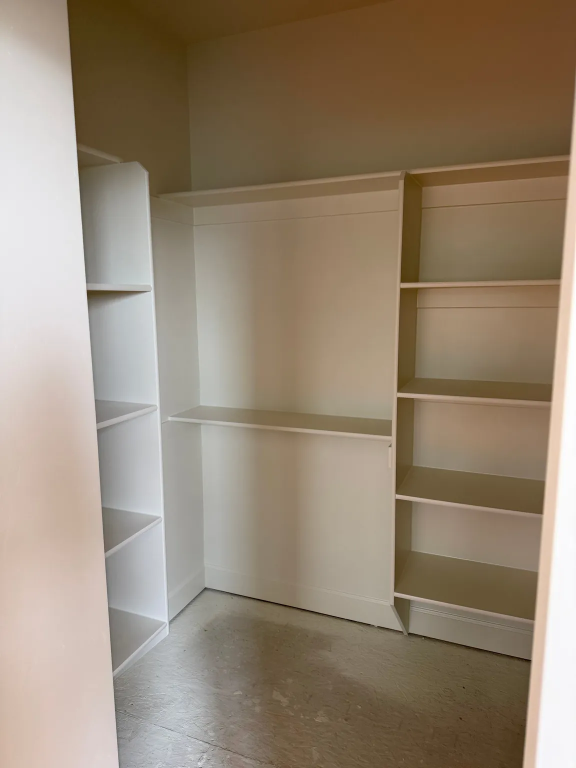Built-in shelving and hanging rods for ample storage