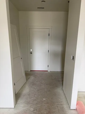 White two-panel door with decorative trim