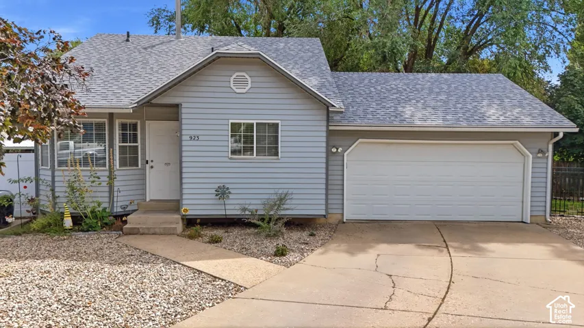 Light blue siding exterior with a shingle roof