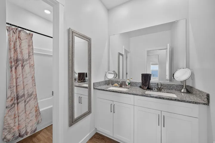 Dual vanity with undermount sinks and granite-style countertops