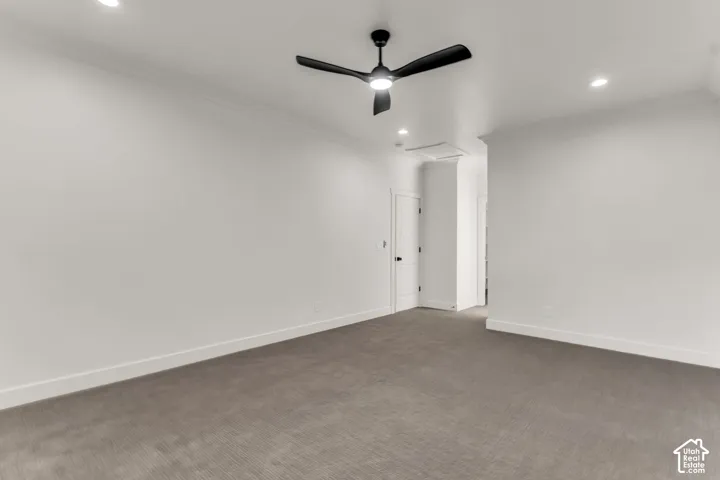 Recessed lighting, crown molding, ceiling fan with integrated light, and neutral wall finishes