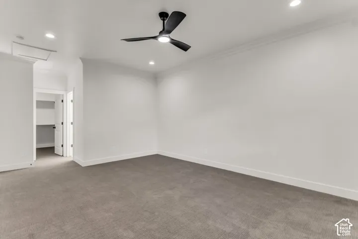 Recessed lighting, crown molding, and a matte black ceiling fan