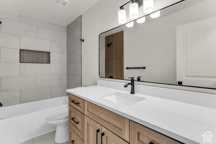 Custom wood-finish vanity with ample storage and matte black hardware