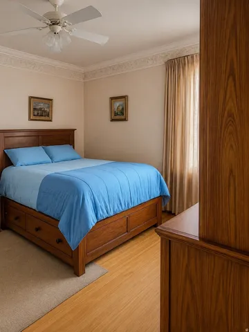 Crown molding accentuates the ceiling, complemented by an overhead fan light fixture