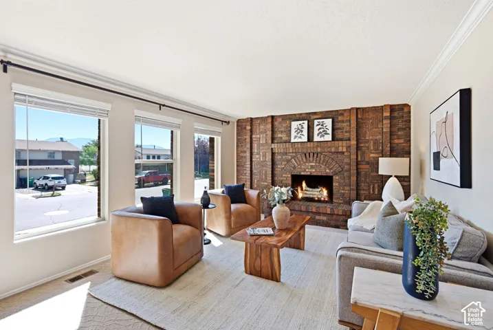 Upstairs living room - Large windows for ample natural light and a fireplace.