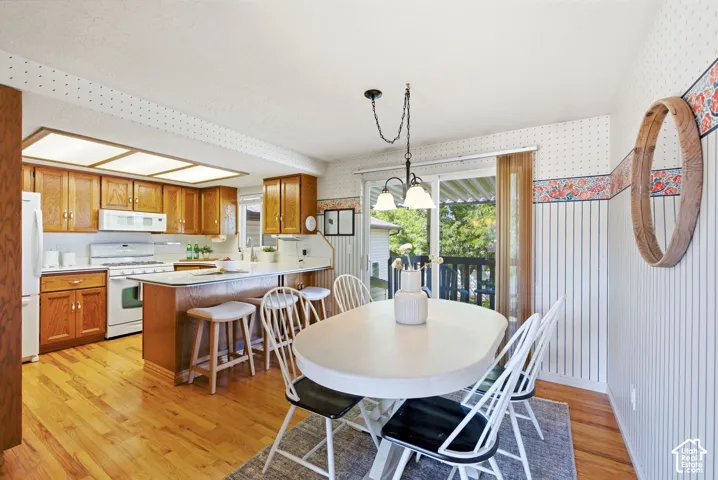 Dining room and kitchen with a dining bar - sliding glass door to the back deck and yard access.