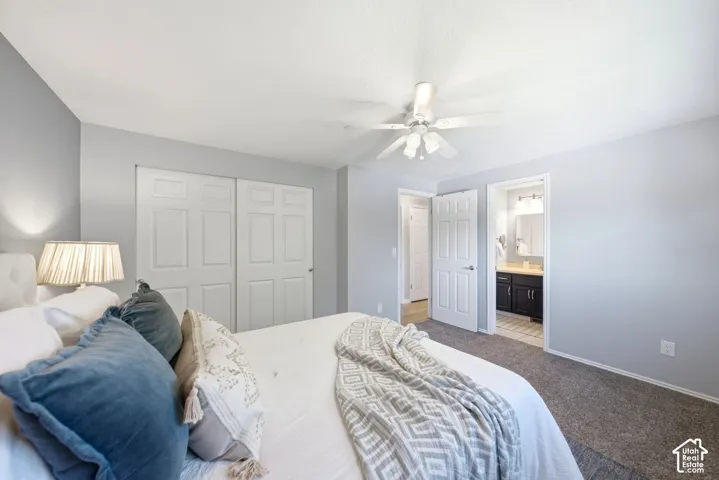 Primary bedroom with large closet and view into the attached bathroom.