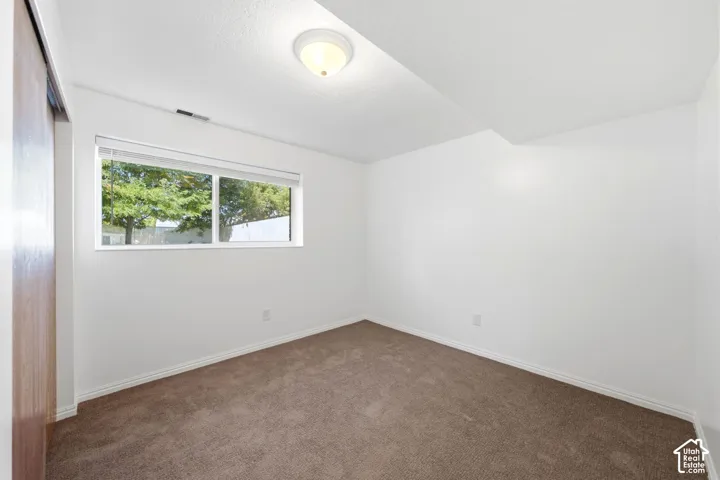 Basement bedroom #1 with full daylight windows.