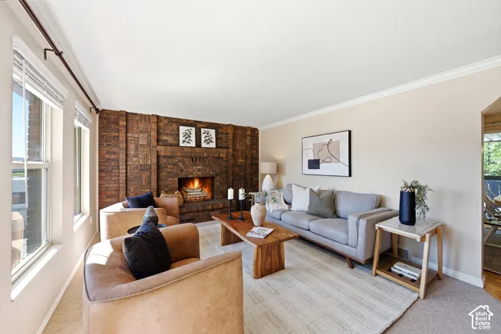 Upstairs living room with large double-hung windows and a fireplace.