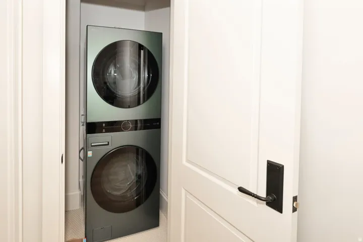 Stackable laundry appliances within a dedicated closet