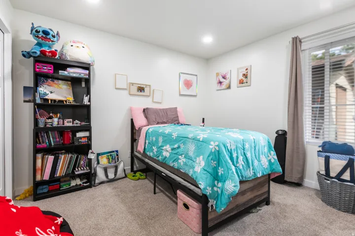 Neutral wall tones complement plush carpeting