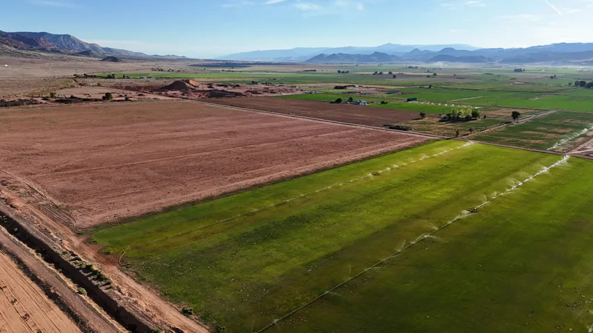 Expansive agricultural land featuring irrigated fields and varied terrain