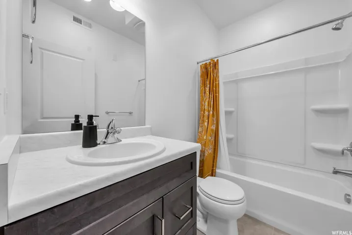 Vanity with a built-in sink, chrome faucet, and integrated mirror