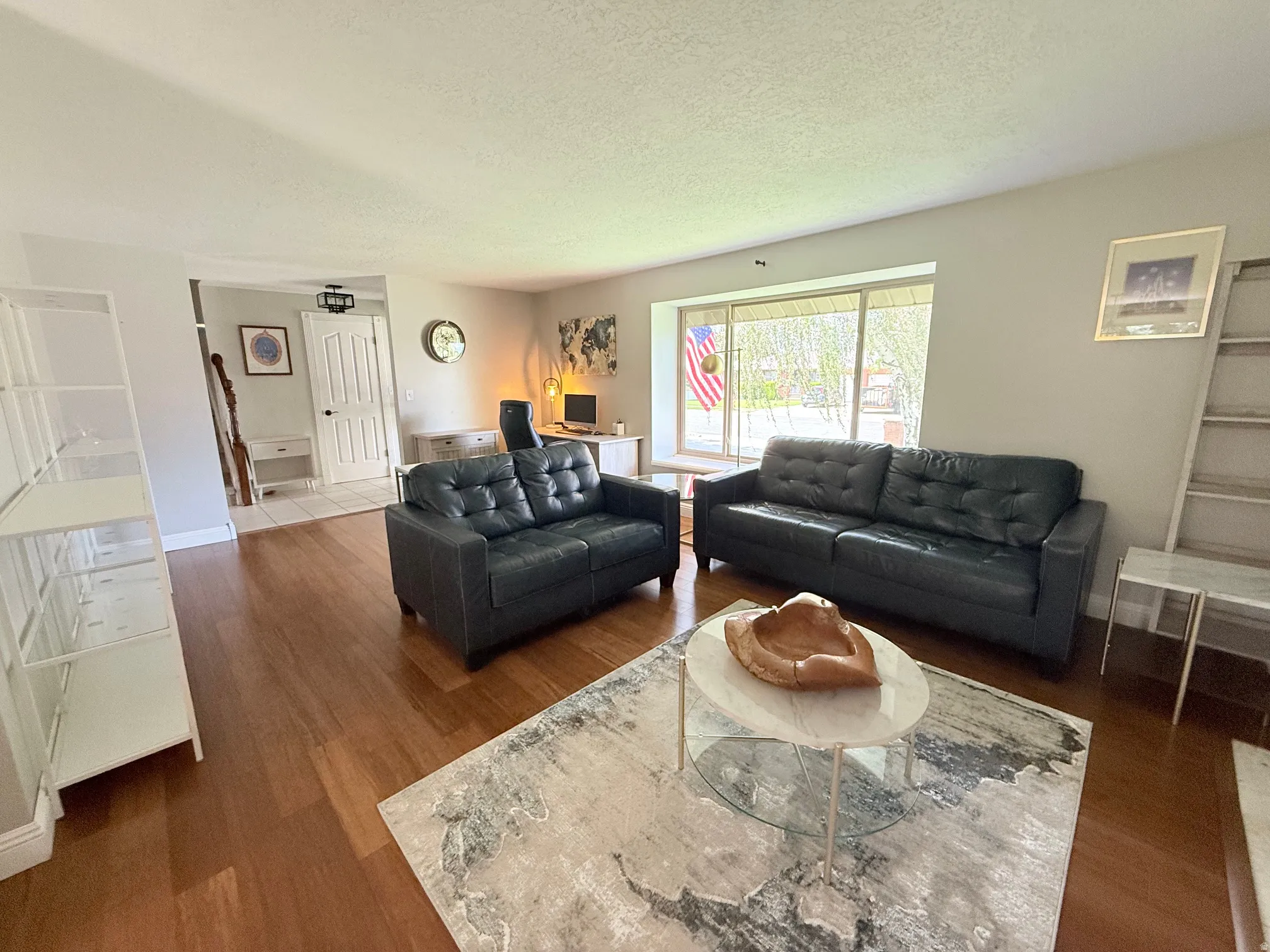 Recessed lighting and wood-finish flooring in the main living area