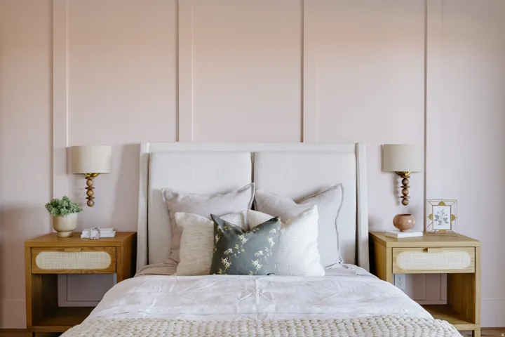 Board and batten accent wall, wood-finish flooring, and built-in wall sconces