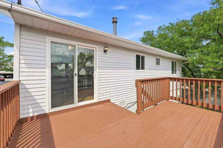 Expansive wood-finish deck with wood railings