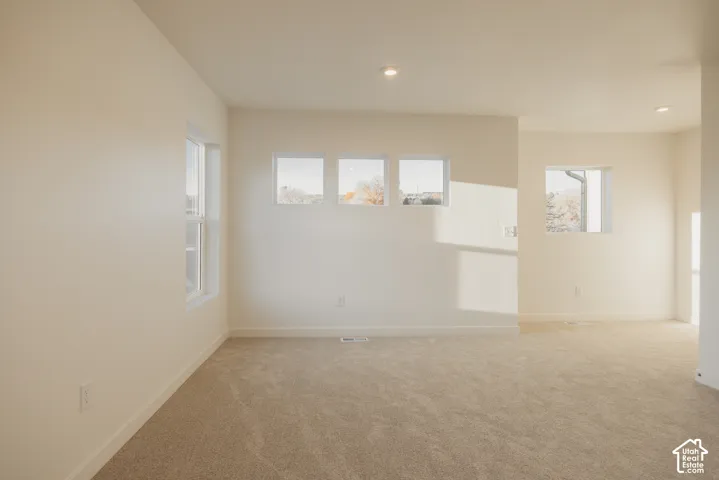 Loft - Recessed lighting, wall-to-wall carpeting, multiple windows, and neutral wall tones