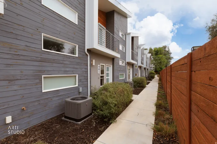 Modern exterior featuring gray horizontal siding and white trim