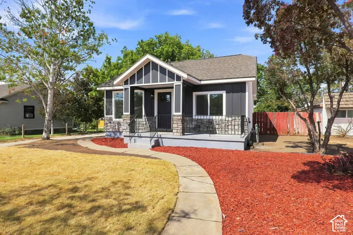 Fiber cement siding exterior with stone accents