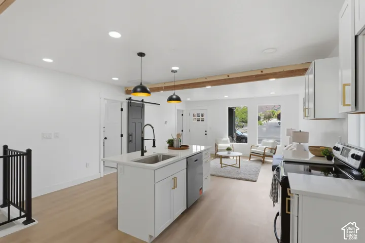 Open-concept living space with wood-finish flooring