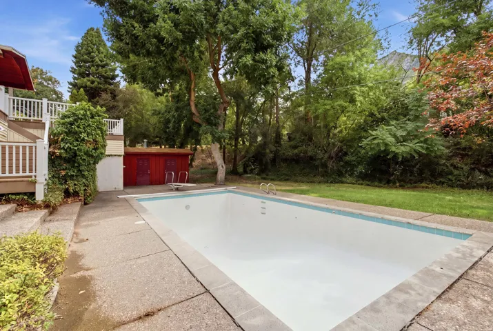 Outdoor swimming pool with concrete surround