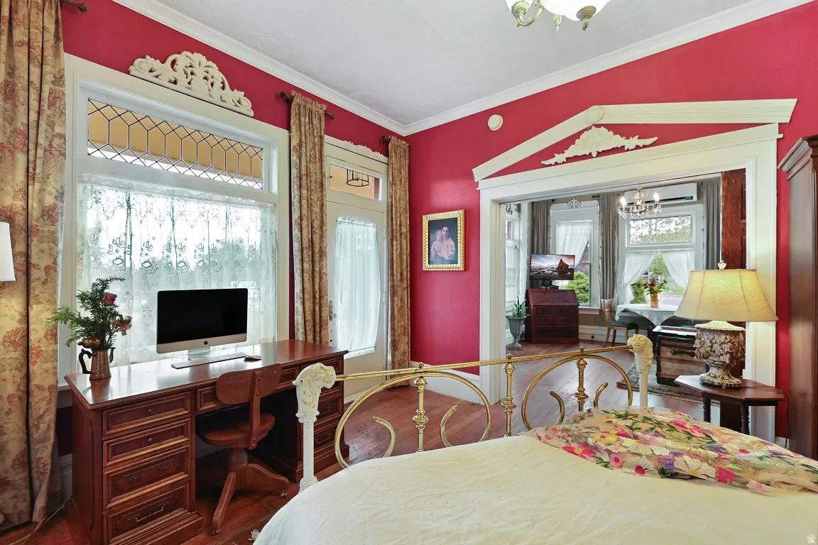 Bed room with office space and entrance to covered patio.