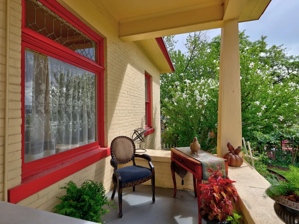 Covered porch with entrance to bedroom.