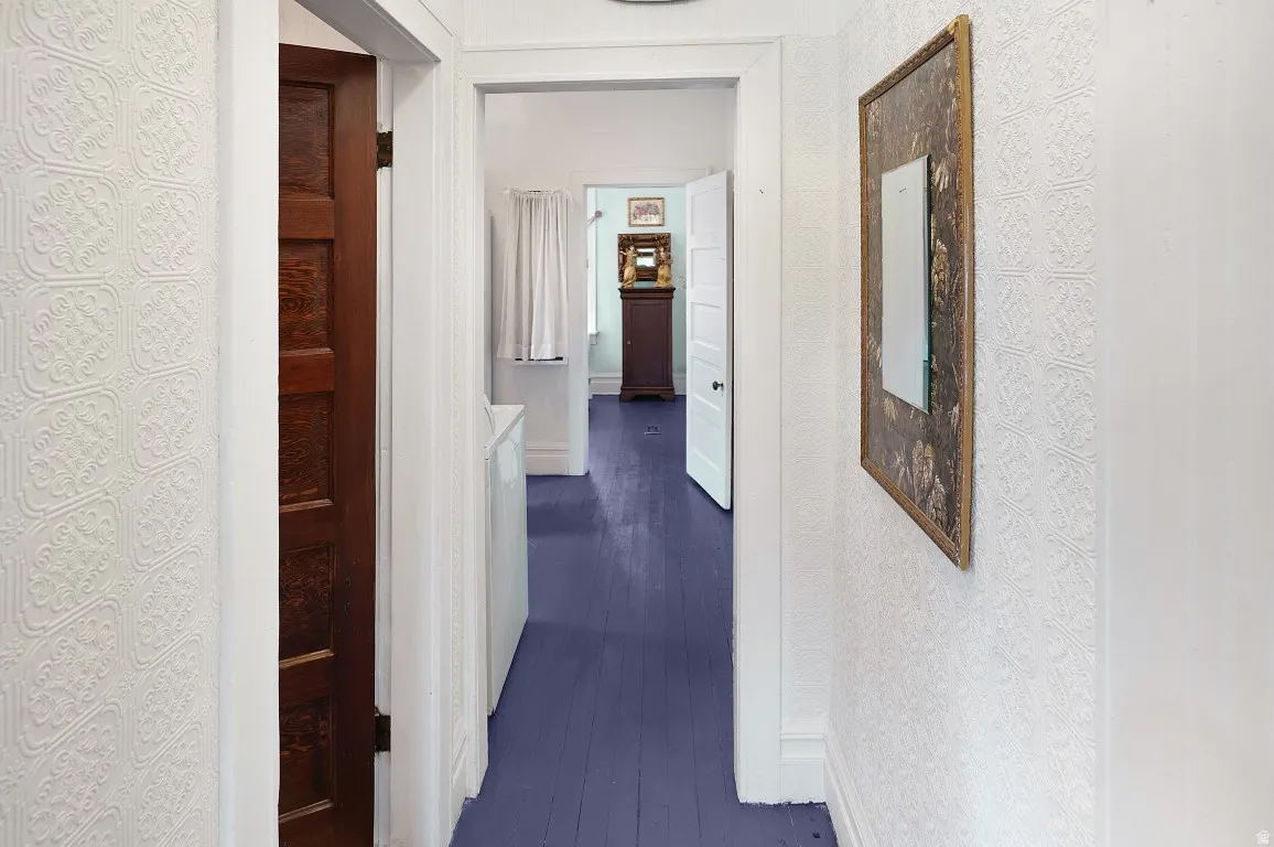 Hallway to bathroom and second bedroom beyond