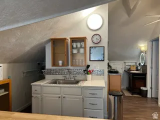 Kitchen area and 3/4 bathroom beyond