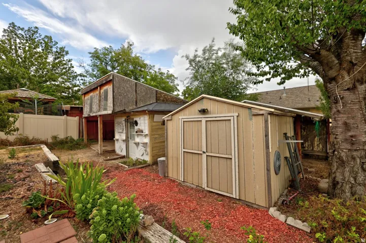 Shed with electricity and room for covered parking beyond