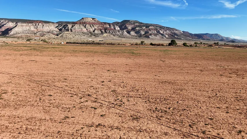 Expansive open land with distant mountain ranges