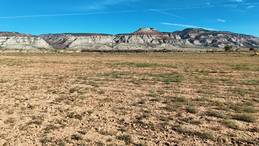 Expansive open land with distant mountain range