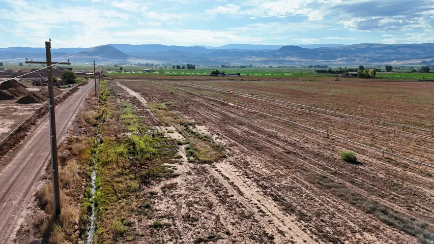 Expansive rural acreage with distant mountain scenery
