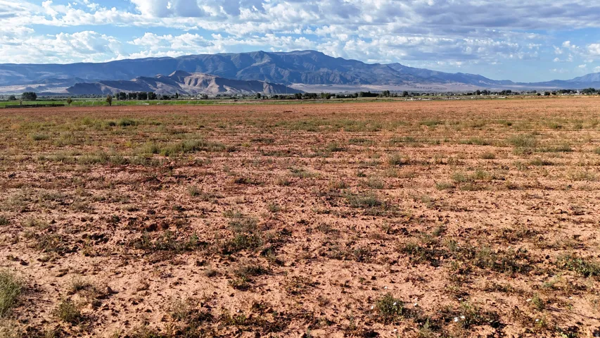 Expansive land parcel with distant mountain scenery