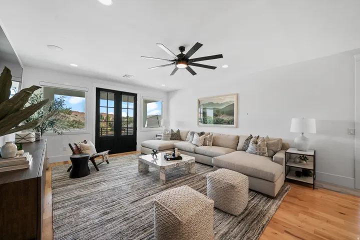 Hardwood flooring, recessed lighting, and a modern ceiling fan