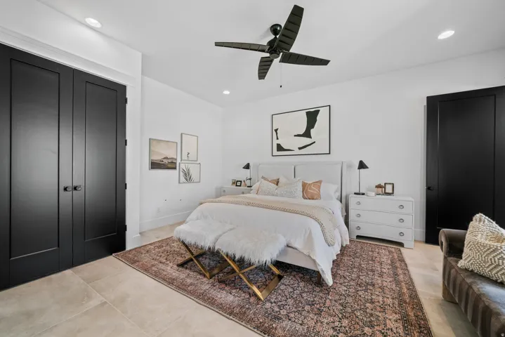 White walls featuring recessed lighting and a black ceiling fan