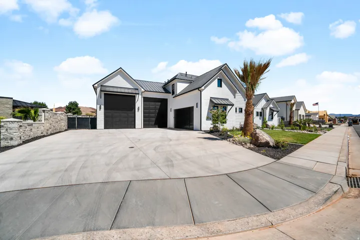 Modern farmhouse-style exterior with white siding and black trim